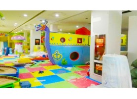 Children have fun at green indoor park Children have fun at green indoor park